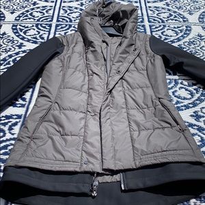 Rain resistant jacket with thumb holes in sleeves